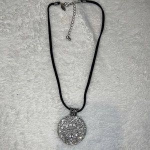 Black leather necklace with silver emblem